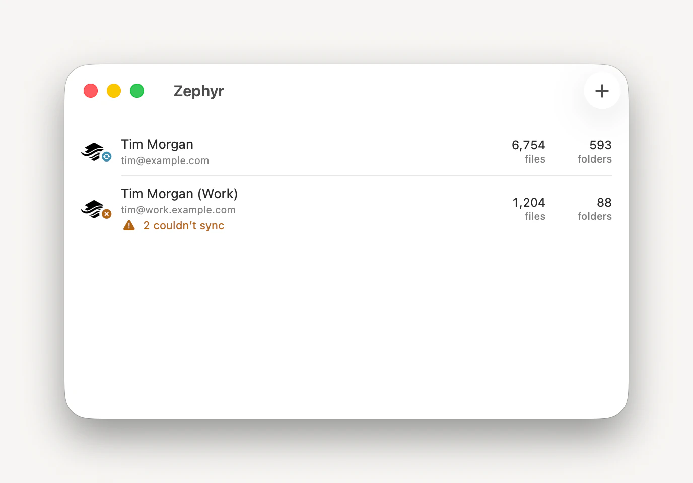 The Zephyr window listing two linked Dropbox accounts, each with its email address and its file and folder counts.
