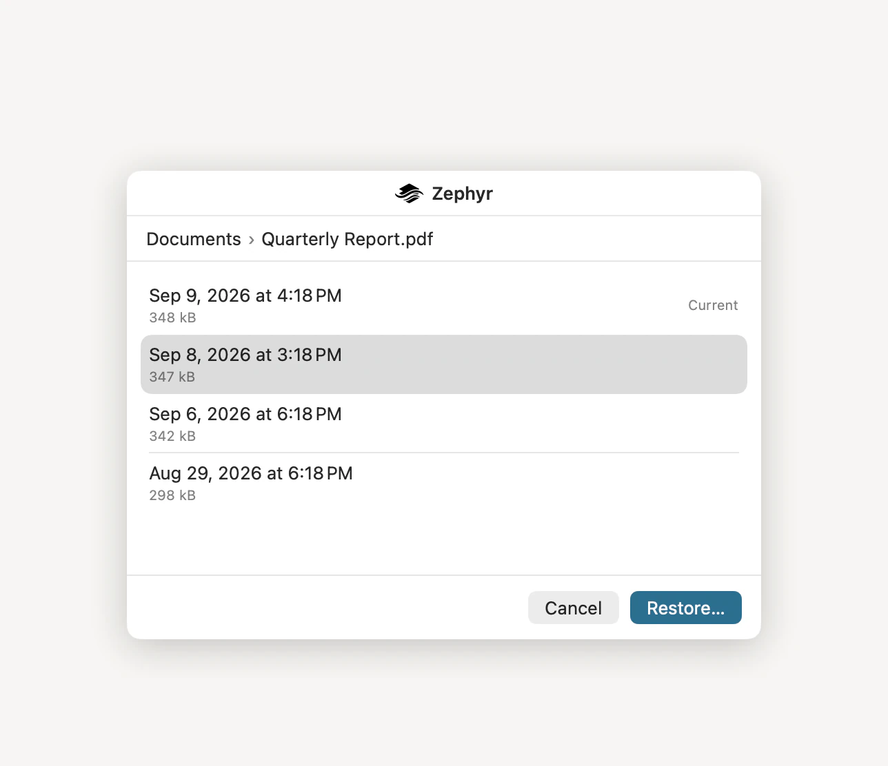 Zephyr’s Show Previous Versions window, listing four dated versions of Quarterly Report.pdf with their sizes, the newest marked Current, above Cancel and Restore buttons.